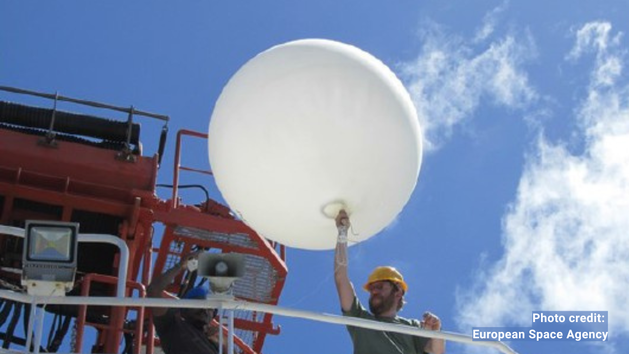 photograph of a weather balloon launch from a ship's deck